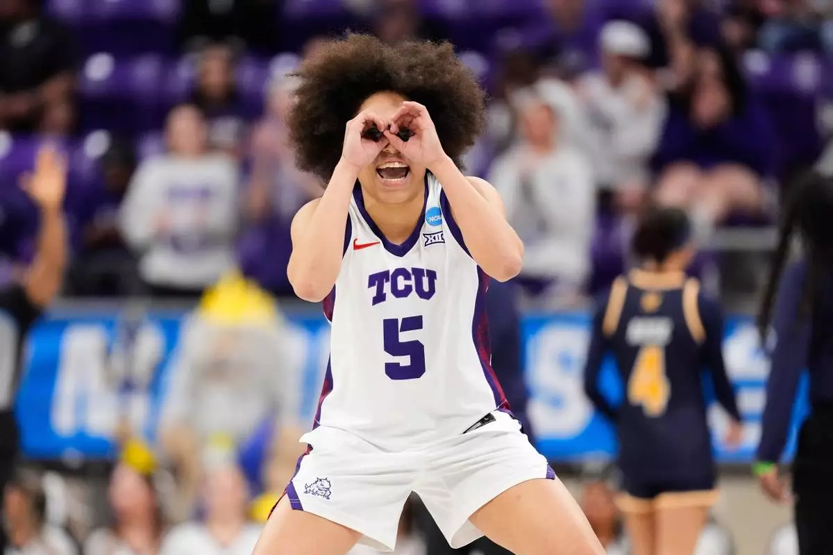 TCU guard Olivia Miles celebrates in the first half in the first round of the NCAA college basketball tournament against UC San Diego, Friday, March 20, 2026, in Fort Worth, Texas. (AP Photo/Tony Gutierrez)
