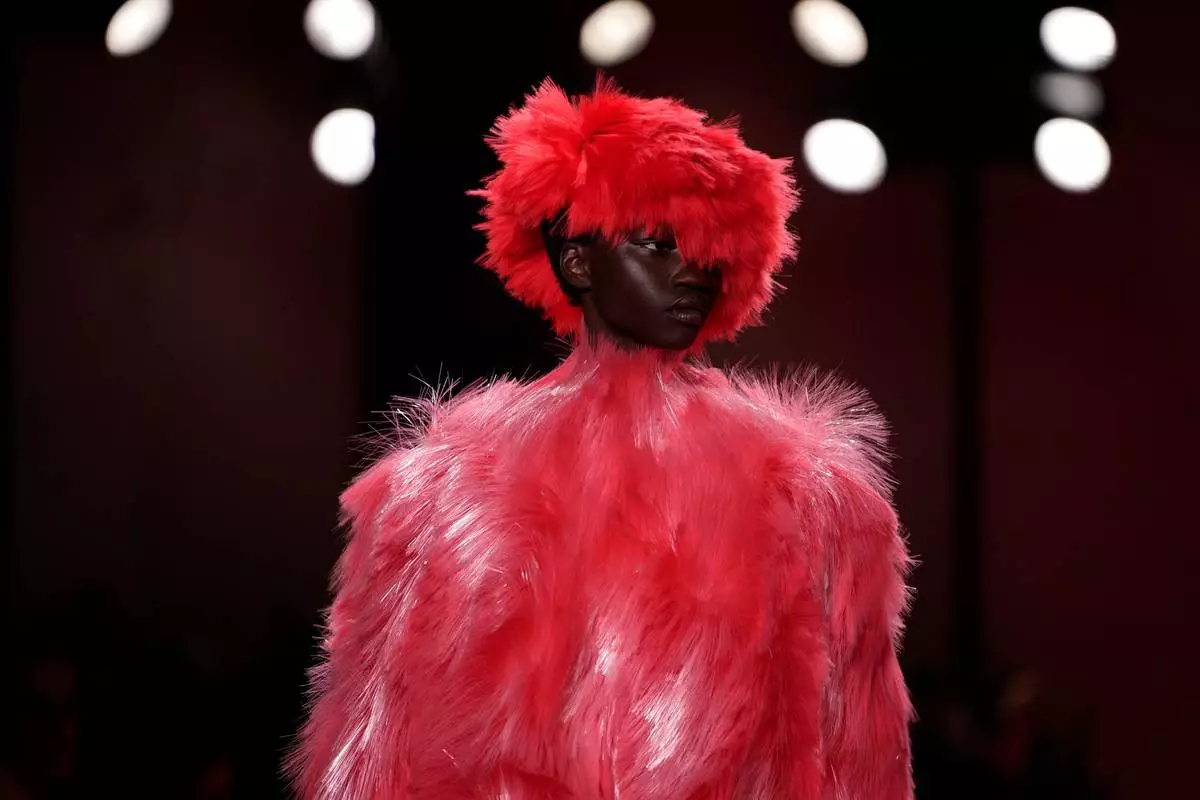 A model wears a creation from the Bottega Veneta Fall/Winter 2026-2027 Women's collection presented in Milan, Italy, Saturday, Feb. 28, 2026. (AP Photo/Luca Bruno)