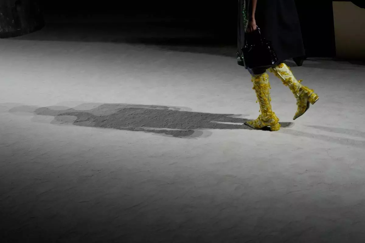 A model wears a creation from the Prada Fall/Winter 2026-2027 Women's collection presented in Milan, Italy, Thursday, Feb. 26, 2026. (AP Photo/Luca Bruno)