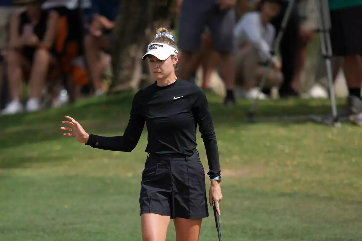 Nelly Korda waves to the crowd after making an eagle on the second hole during the final round of the LPGA Ford Championship golf tournament, Sunday, March 29, 2026, in Chandler, Ariz. (AP Photo/Ross D. Franklin)