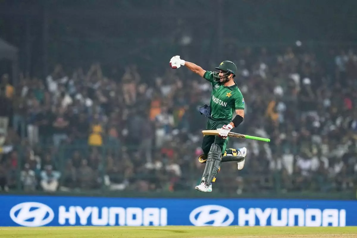 Pakistan's Sahibzada Farhan celebrates his century during the T20 World Cup cricket match between Pakistan and Sri Lanka in Pallekele, Sri Lanka, Saturday, Feb. 28, 2026. (AP Photo/Eranga Jayawardena)