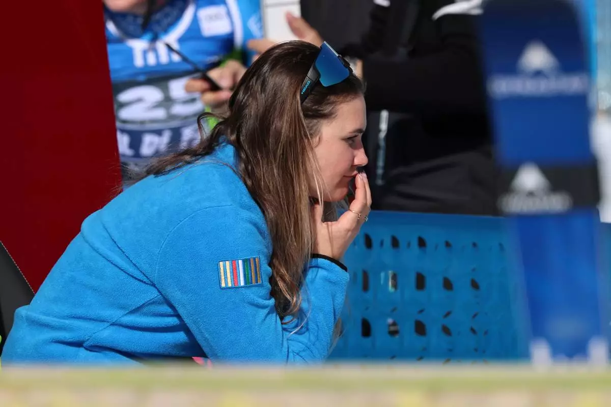Italy's Laura Pirovano sits in the leaders' corner at the finish area of an alpine ski, women's World Cup downhill, in Val di Fassa, Italy, Friday, March 6, 2026. (AP Photo/Marco Trovati) CORRECTION: Date corrected to March 6, instead of February 27.