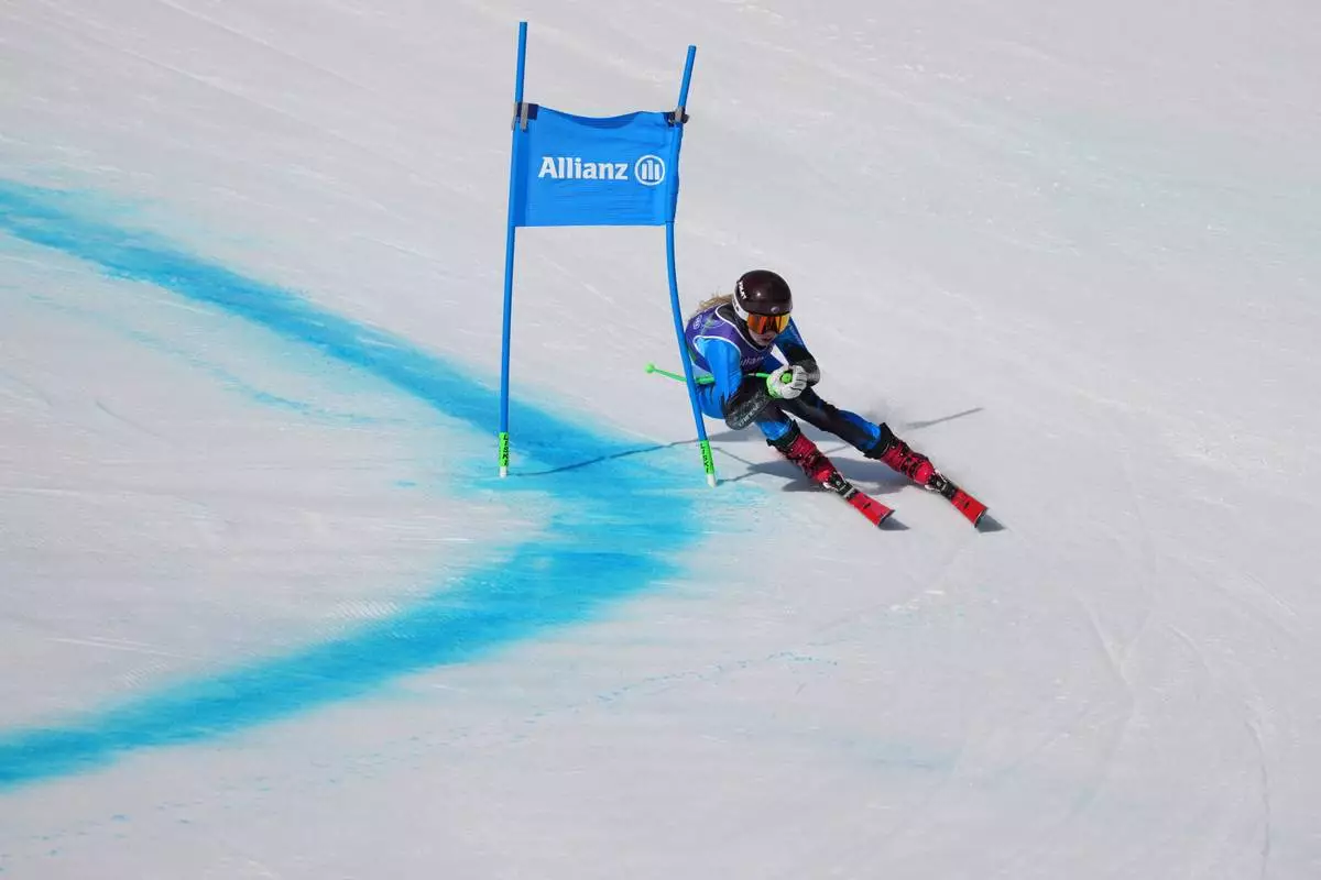 Varvara Voronchikhina, of Russia, competes in the alpine skiing women's super-G standing final at the 2026 Winter Paralympics, in Cortina d'Ampezzo, Italy, Monday, March 9, 2026. (AP Photo/Evgeniy Maloletka)