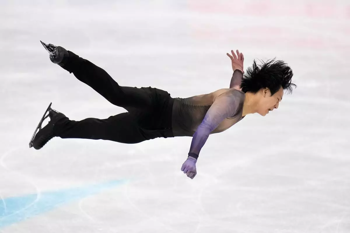 Adam Siao Him Fa from France competes during the men's short program at the Figure Skating World Championships in Prague, Czech Republic, Thursday, March 26, 2026. (AP Photo/Petr David Josek)