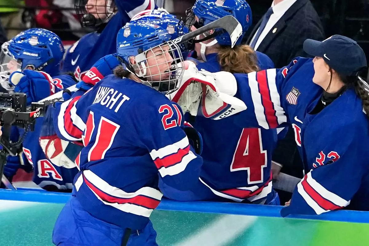 United States' Hilary Knight (21) celebrates after scoring her side's opening goal during a women's ice hockey gold medal game between the United States and Canada at the 2026 Winter Olympics, in Milan, Italy, Thursday, Feb. 19, 2026. (AP Photo/Hassan Ammar)