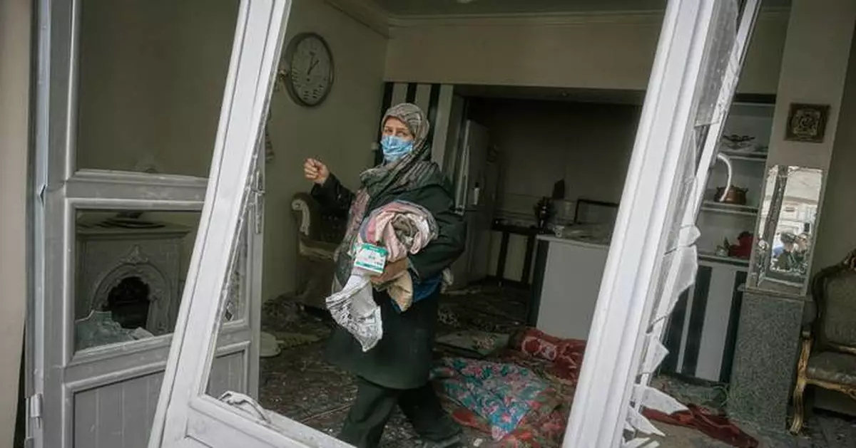 Photos show destruction in northwest Iran after strike hits a residential building