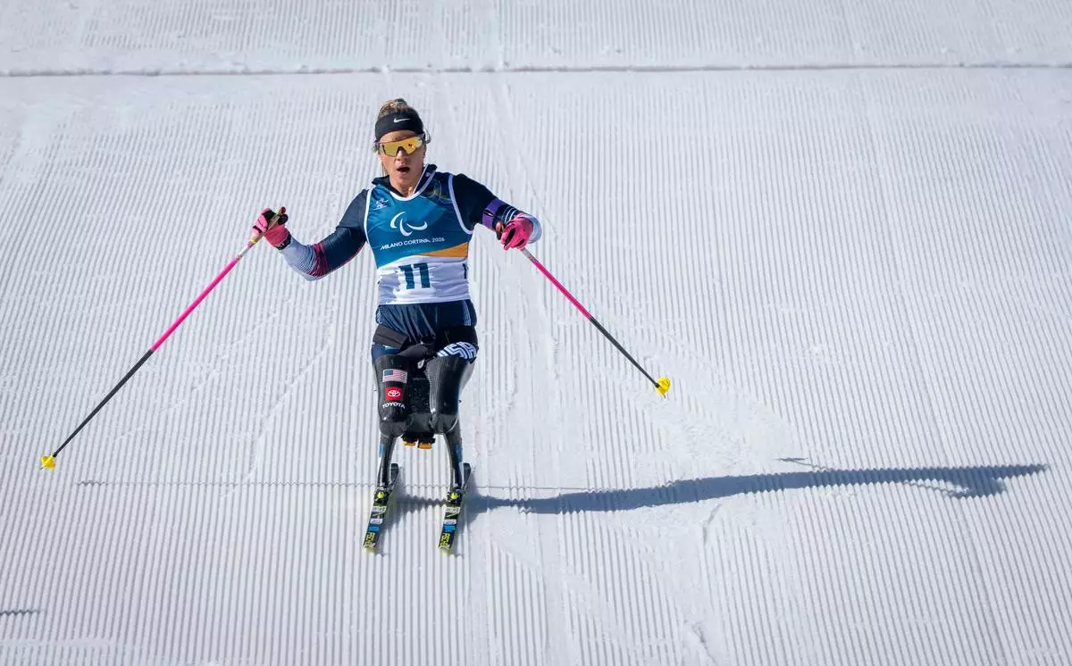 Oksana Masters of the USA competes in the Para Biathlon Women's sprint sitting at the 2026 Winter Paralympics, in Tesero, Italy, Saturday, March 7, 2026. (AP Photo/Kirsty Wigglesworth)