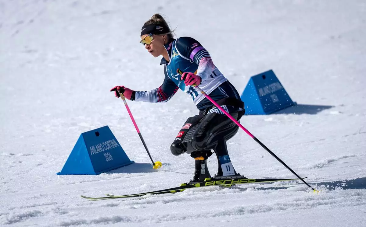 Oksana Masters of the USA competes in the Para Biathlon Women's sprint sitting at the 2026 Winter Paralympics, in Tesero, Italy, Saturday, March 7, 2026. (AP Photo/Kirsty Wigglesworth)