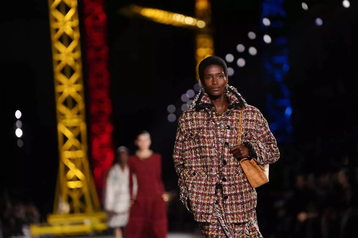 A model wears a creation as part of the Chanel Fall/Winter 2026-2027 Women's collection presented in Paris, Monday, March 9, 2026. (AP Photo/Aurelien Morissard)