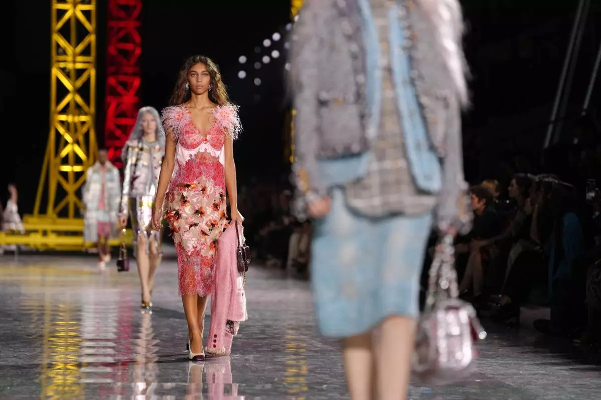 A model wears a creation as part of the Chanel Fall/Winter 2026-2027 Women's collection presented in Paris, Monday, March 9, 2026. (AP Photo/Aurelien Morissard)