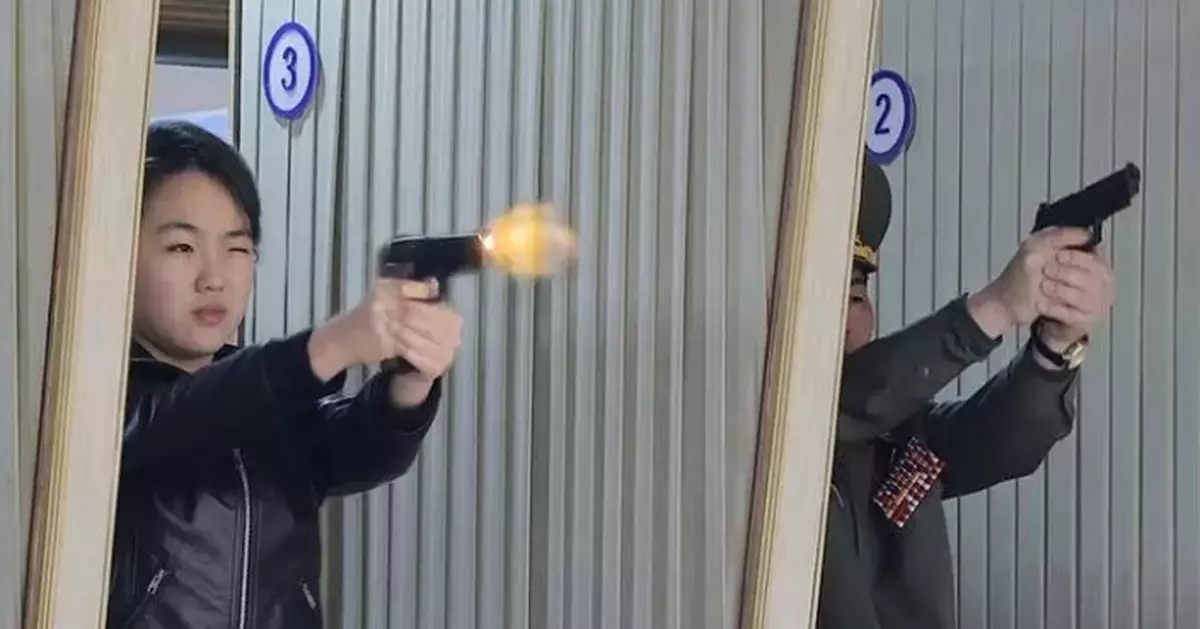 North Korean leader Kim and his daughter try out new pistols at shooting range