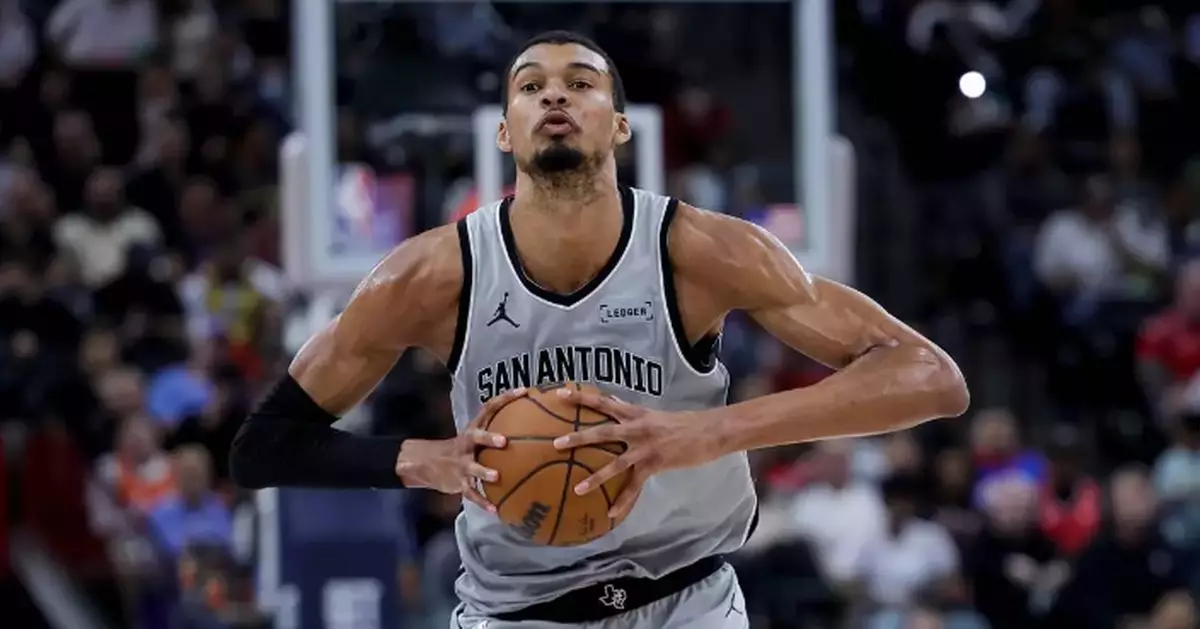 Wembanyama powers Spurs past Clippers 119-115 after wild swings and a late scare to reach 50 wins