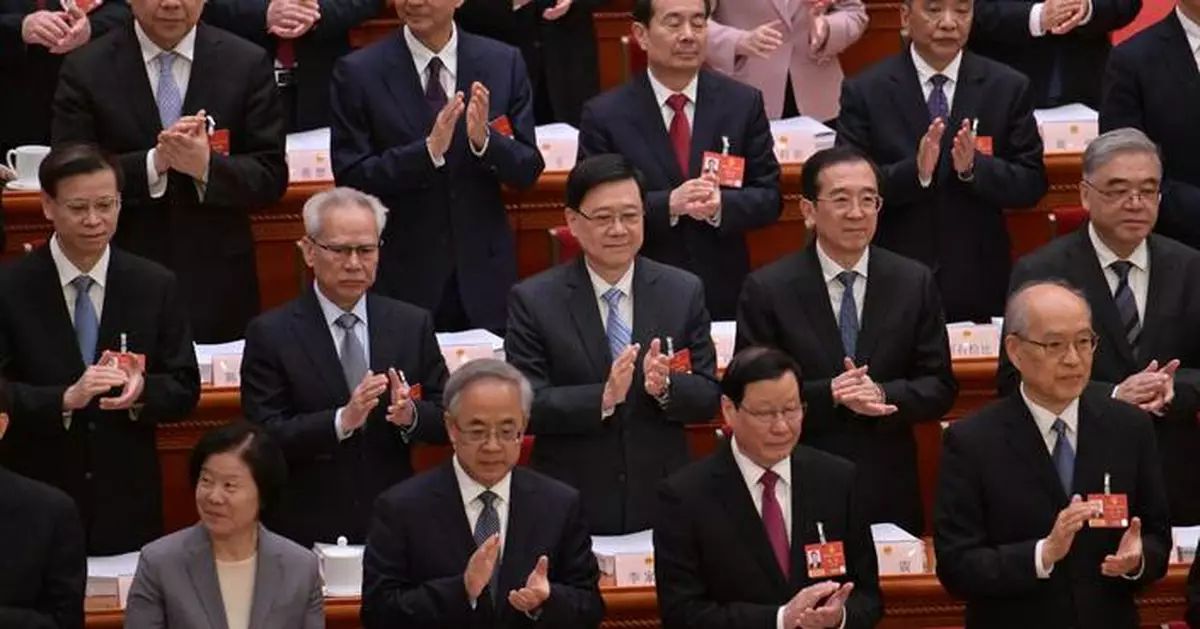 John Lee Attends Opening of 14th National People's Congress Session in Beijing