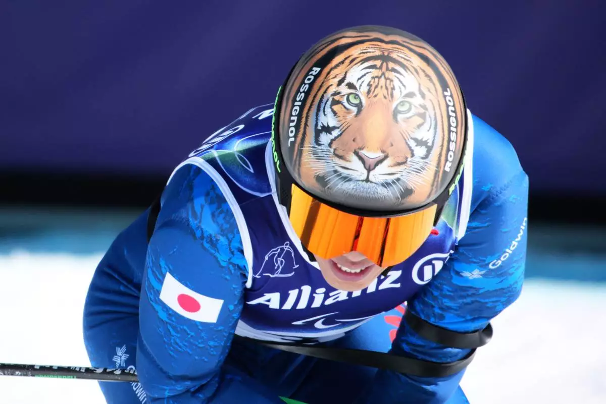 Gakuta Koike, of Japan, reacts after competing in the alpine skiing men's downhill standing competition at the 2026 Winter Paralympics, in Cortina d'Ampezzo, Italy, Saturday, March 7, 2026. (AP Photo/Emilio Morenatti)