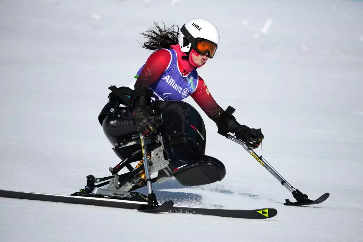 Liu Sitong, of China, competes in the alpine skiing women's downhill sitting competition at the 2026 Winter Paralympics, in Cortina d'Ampezzo, Italy, Saturday, March 7, 2026. (AP Photo/Emilio Morenatti)