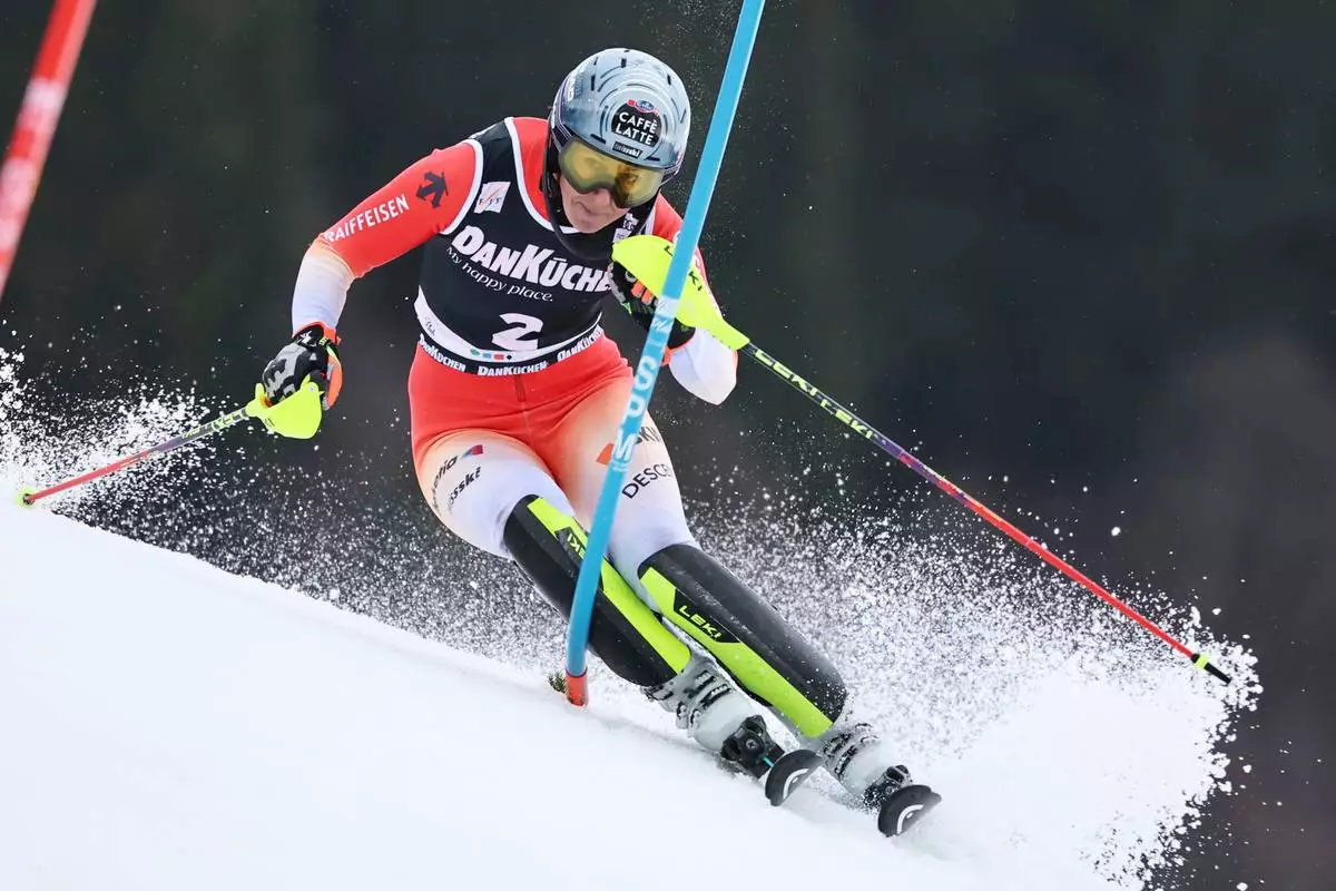 Switzerland's Wendy Holdener is airborne during an alpine ski, women's downhill training, at the Lillehammer World Cup Finals, in Kvitfjell, Norway, Friday, March 20, 2026. (AP Photo/Marco Trovati)