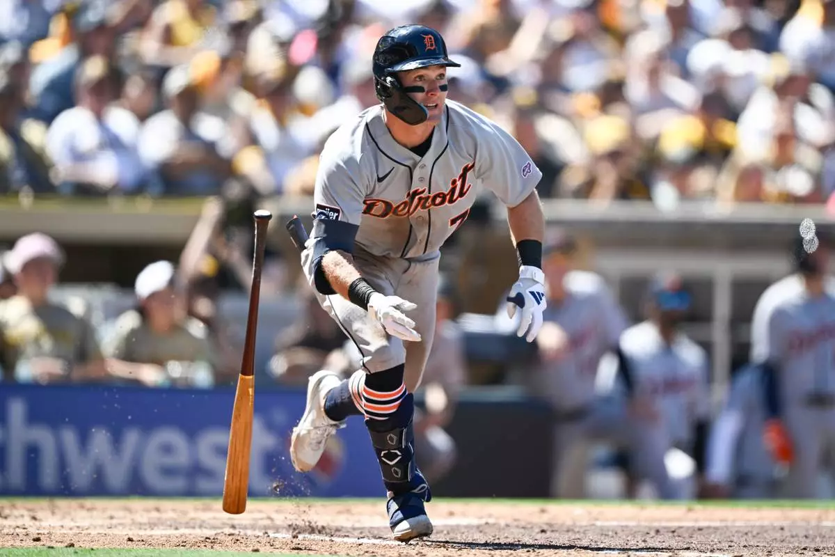 Detroit Tigers' Kevin McGonigle (7) hits a double during the third inning of an opening-day baseball game against the San Diego Padres Thursday, March 26, 2026, in San Diego. (AP Photo/Denis Poroy) CORRECTS SPELLING OF McGonigle from McGonigal.
