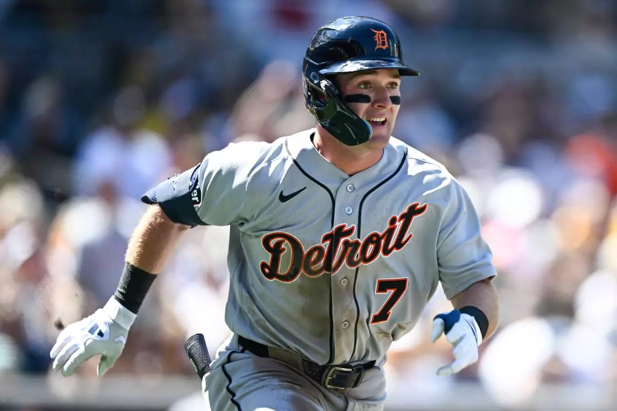 Detroit Tigers' Kevin McGonigle (7) hits a double during the third inning of an opening-day baseball game against the San Diego Padres Thursday, March 26, 2026, in San Diego. (AP Photo/Denis Poroy) CORRECTS SPELLING OF McGonigle from McGonigal.