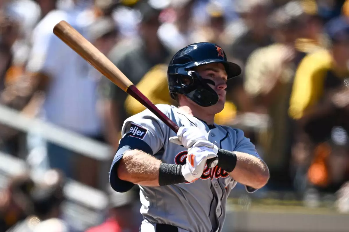 Detroit Tigers' Kevin McGonigle watches his RBI double during the first inning of an opening-day baseball game against the San Diego Padres, Thursday, March 26, 2026, in San Diego. (AP Photo/Denis Poroy) CORRECTS SPELLING OF McGonigle from McGonigal.