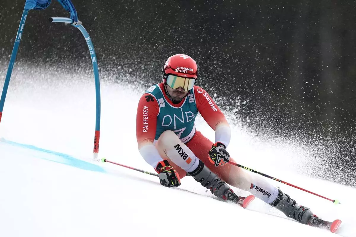 Switzerland's Loic Meillard competes in an alpine ski, men's giant slalom race, at the Lillehammer World Cup Finals, in Hafjell, Norway, Tuesday, March 24, 2026. (AP Photo/Gabriele Facciotti)