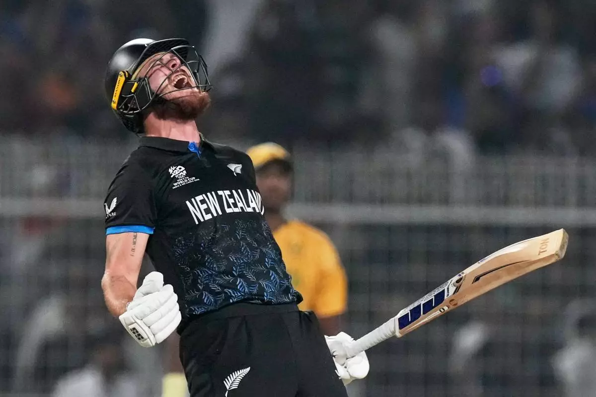 New Zealand's Finn Allen reacts after hitting the winning runs and finishing his century during the first T20 World Cup cricket semifinal match between New Zealand and South Africa in Kolkata, India, Wednesday, March 4, 2026. (AP Photo/Bikas Das)