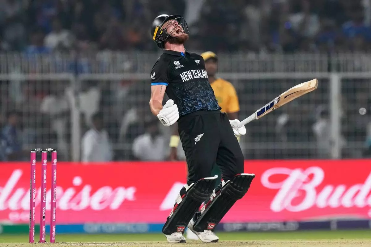 New Zealand's Finn Allen reacts after hitting the winning runs and finishing his century during the first T20 World Cup cricket semifinal match between New Zealand and South Africa in Kolkata, India, Wednesday, March 4, 2026. (AP Photo/Bikas Das)