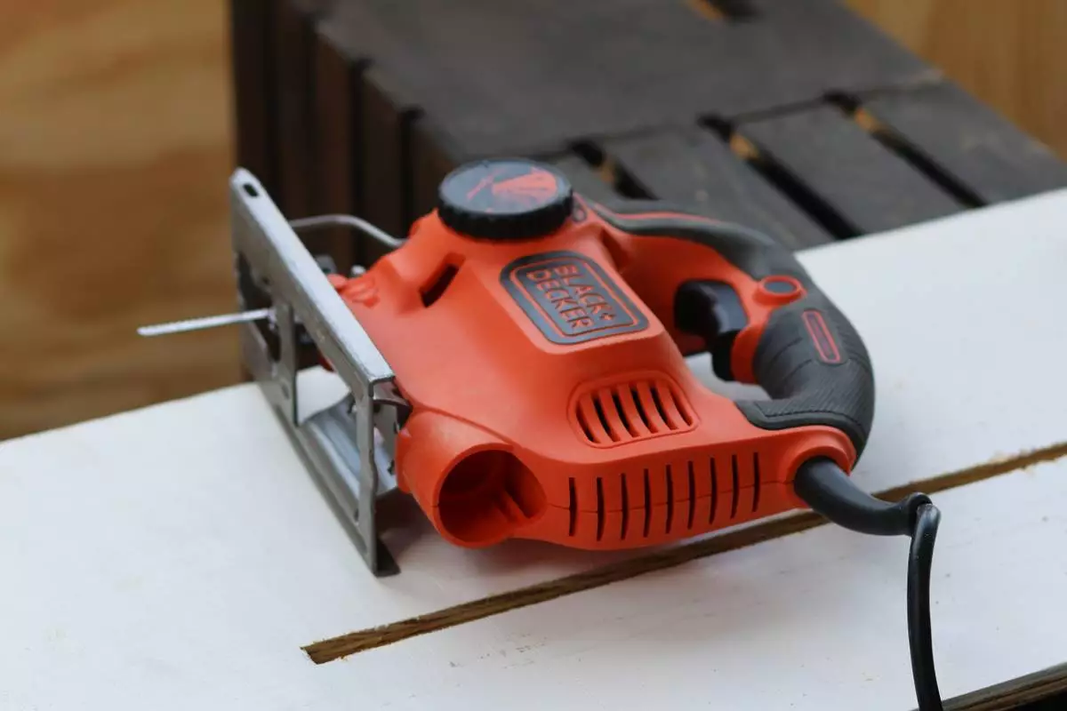 A jigsaw lays on a piece of plywood intended for a wedding sign at a do-it-yourself party at an apartment in Flagstaff, Ariz., Sunday, February 15, 2026. (AP Photo/Cheyanne Mumphrey)