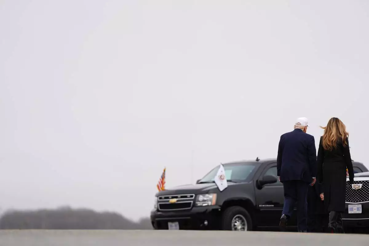 President Donald Trump and first lady Melania Trump depart a casualty return for the soldiers who were killed in a drone strike at a command center in Kuwait after the U.S. and Israel launched its military campaign against Iran, Saturday, March 7, 2026, at Dover Air Force Base, Del. (AP Photo/Julia Demaree Nikhinson)