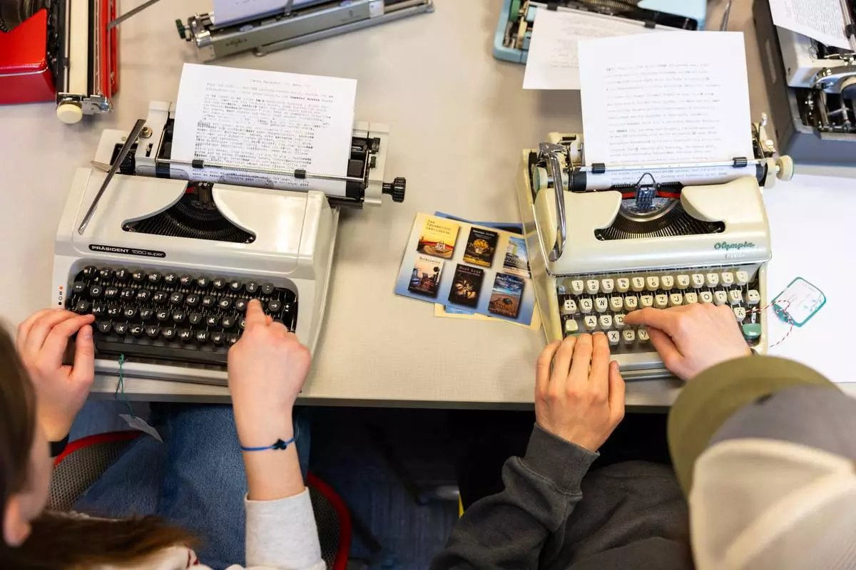 Student use typewriters to complete a writing assignment in German at Cornell University, Friday, March 20, 2026, in Ithaca, N.Y. The professor, Grit Matthias Phelps, brings out the typewriters once each semester for students to disconnect from technology and connect with the assignment in a different way. (AP Photo/Lauren Petracca)