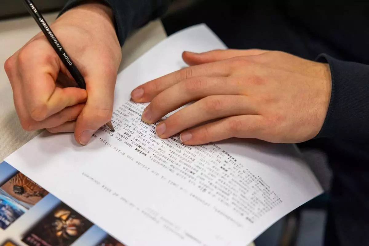 Marcello Popelka makes edits using a pencil after writing an assignment in German on a typewriter at Cornell University, Friday, March 20, 2026, in Ithaca, N.Y. The professor, Grit Matthias Phelps, brings out the typewriters once each semester for students to disconnect from technology and connect with the assignment in a different way. (AP Photo/Lauren Petracca)