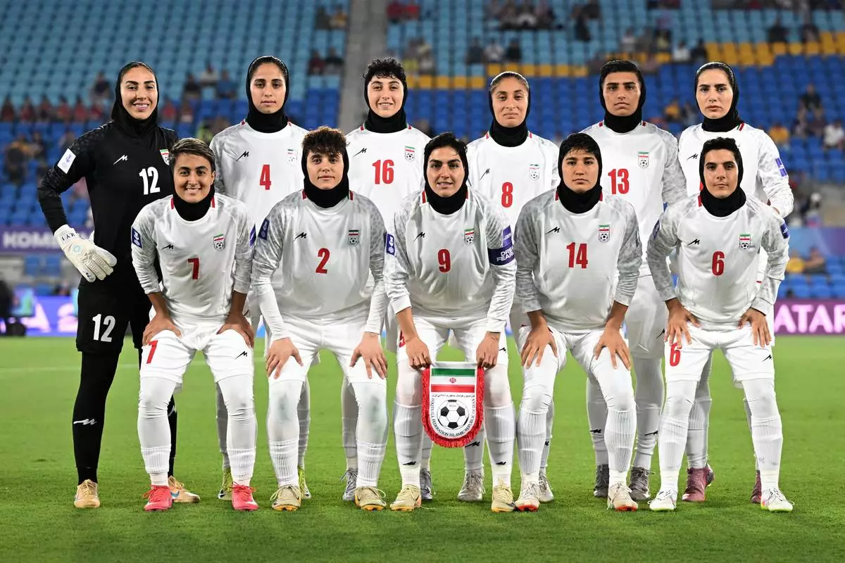 Iran players pose for a team photo ahead of the Women's Asia Cup soccer match between Iran and South Korea on the Gold Coast, Australia, Monday, March 2, 2026. (Dave Hunt/AAPImage via AP)/AAP Image via AP)/AAP Image via AP)