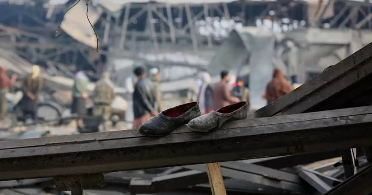 Rescue crews race through rubble after a deadly Kabul airstrike, in photos