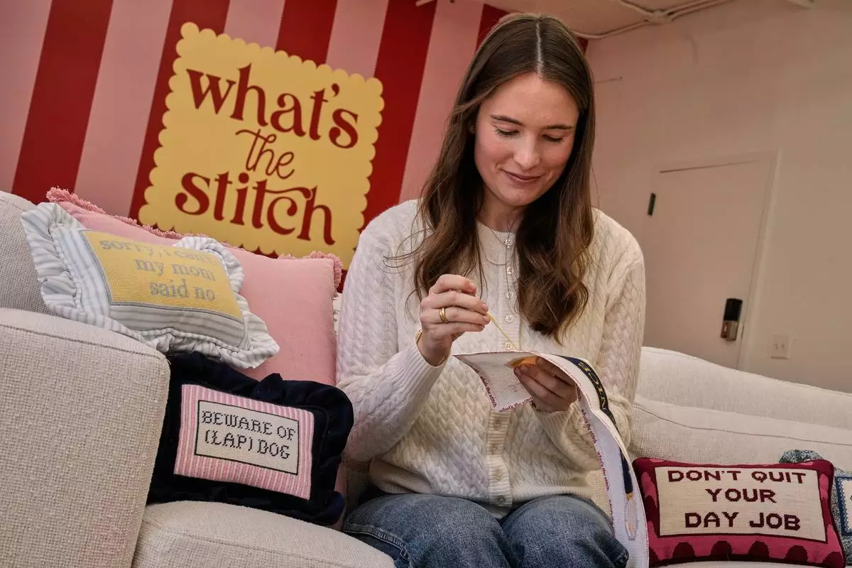 Emma MacTaggart, founder of What's the Stitch needlepoint business, is photographed in her studio, in New York, Monday, Feb. 9, 2026. (AP Photo/Richard Drew)