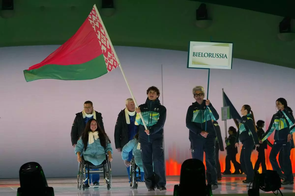 Athletes from Belarus walk during the opening ceremony at the 2026 Winter Paralympics, in Verona, Italy, Friday, March 6, 2026. (AP Photo/Antonio Calanni)