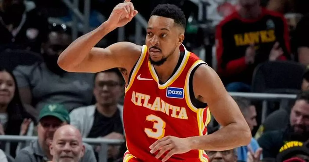McCollum scores 30, Johnson has a triple-double as the Hawks beat the Bucks for 9th straight win