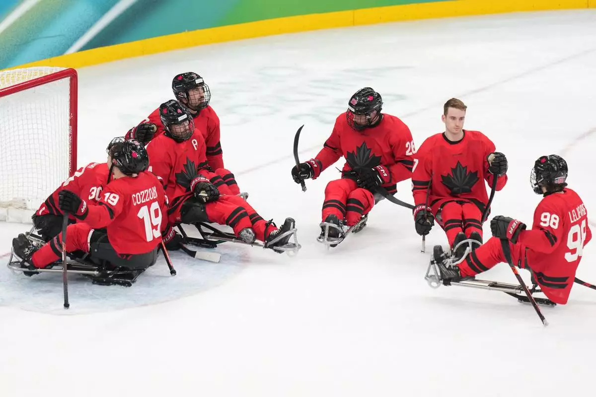 Canada's players reacts after loosing the ice hockey gold medal match between United States and Canada at the 2026 Winter Paralympics, in Milan, Italy, Sunday, March 15, 2026. (AP Photo/Antonio Calanni)