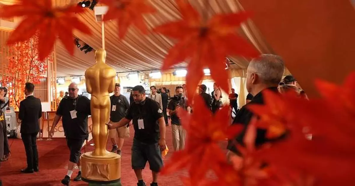 Oscars red carpet sees pops of color as stars arrive