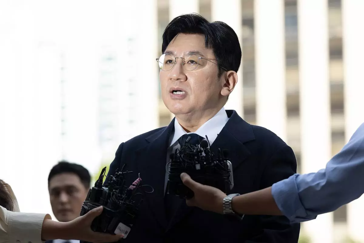 Bang Si-Hyuk, a chairman of HYBE answers reporters' question upon his arrival at the Seoul Metropolitan Police Agency in Seoul, South Korea, Monday, Sept. 15, 2025. (Kim Keun-soo/Newsis via AP)