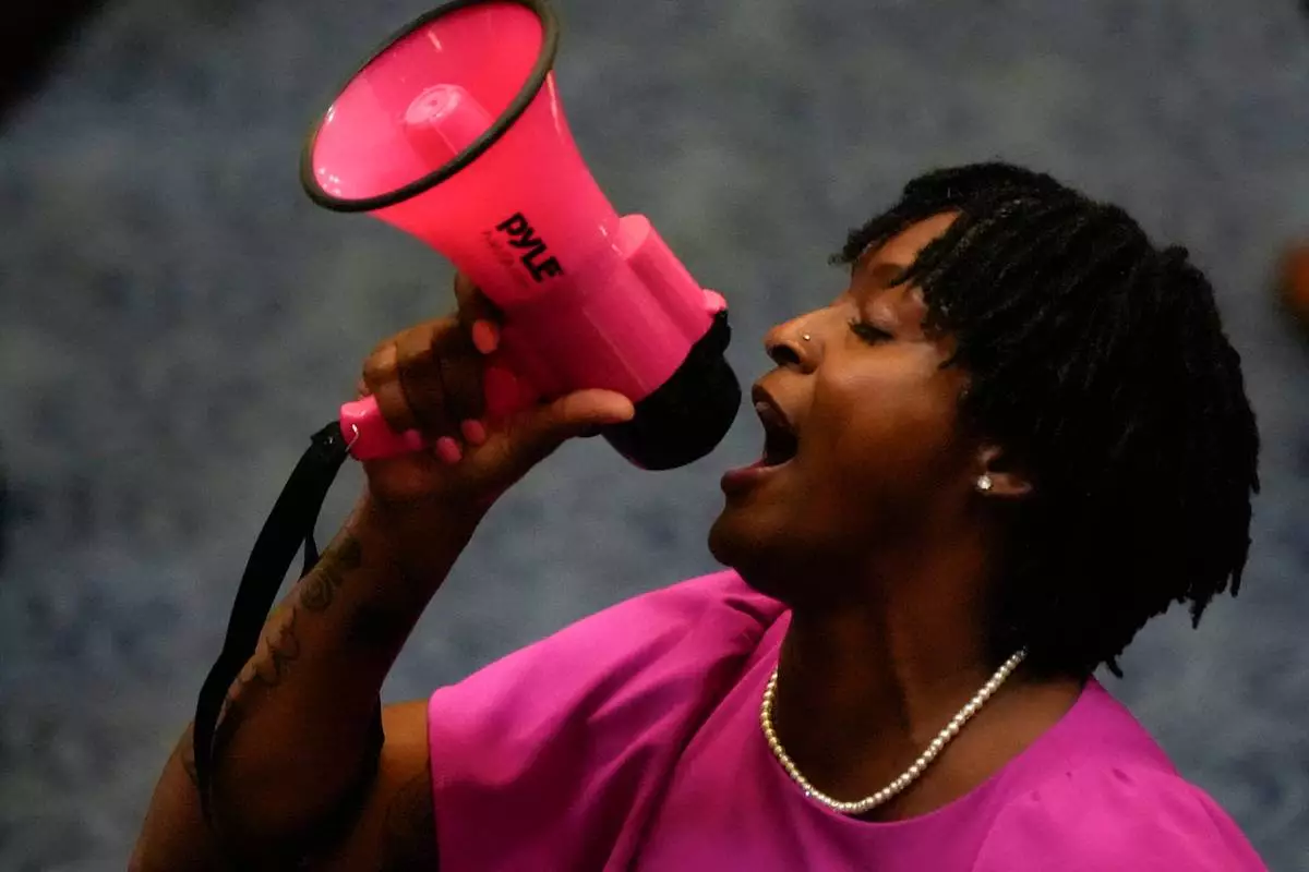 State Rep. Angie Nixon, D-Fla., speaks loudly on the House floor as the House voted on HB1D, a redistricting bill, during a special session of the Florida Legislature, Wednesday, April 29, 2026, in Tallahassee, Fla. (AP Photo/Mike Stewart)