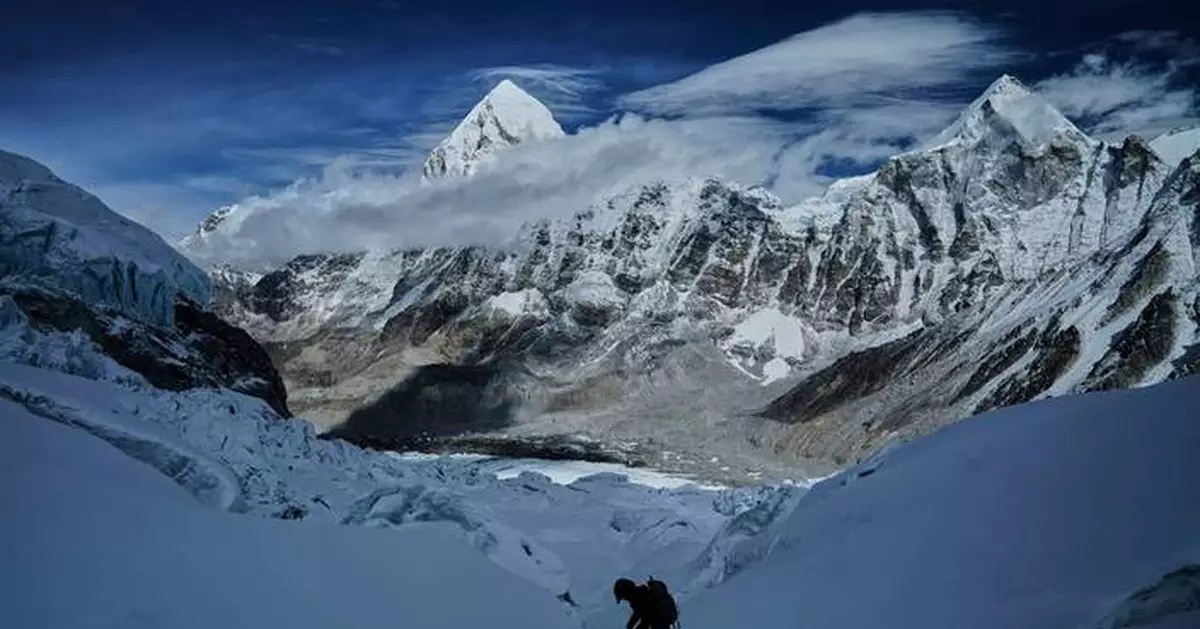 A massive, unstable ice block stalls Everest climbers at base camp