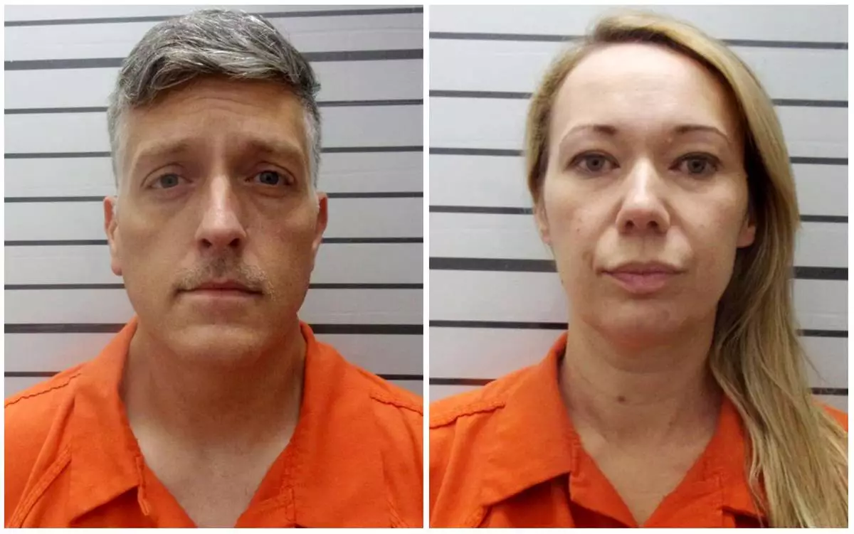 FILE - This combination of booking photos provided by the Muskogee County, Okla., Sheriff's Office shows Jon Hallford, left, and Carie Hallford, owners of Return to Nature Funeral Home. (Muskogee County Sheriff's Office via AP, File)