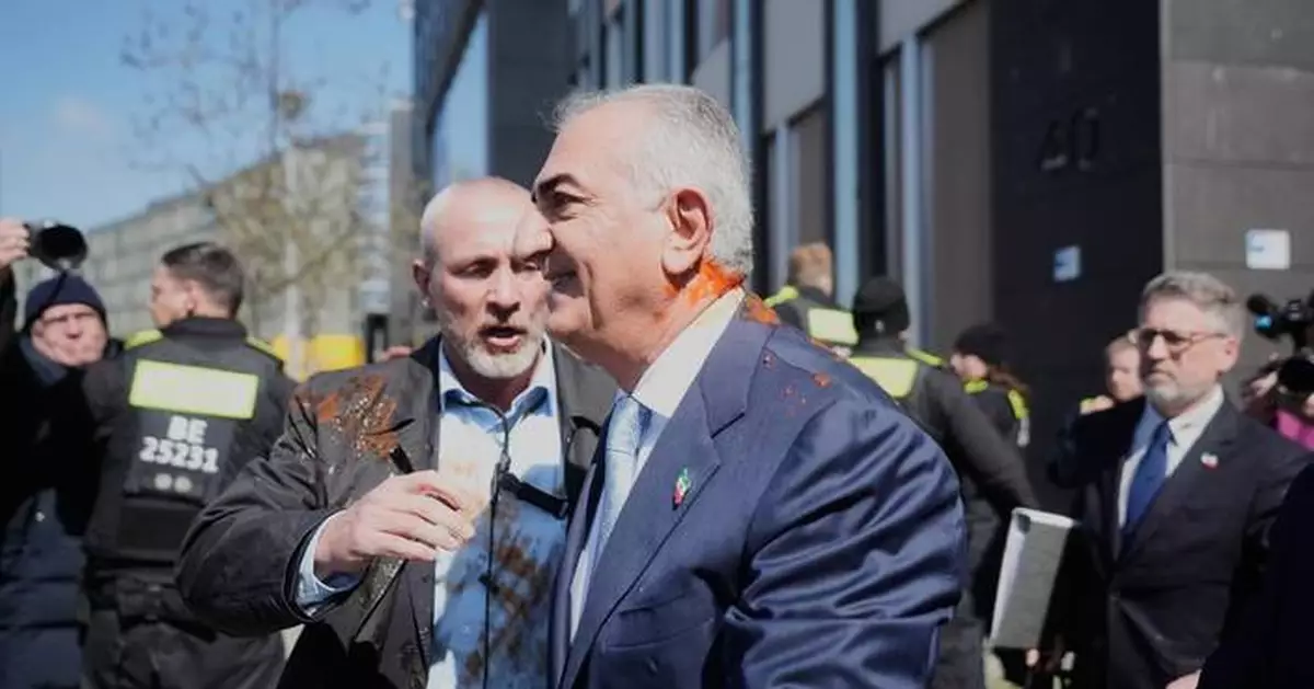 Iran’s exiled crown prince Reza Pahlavi splattered with red liquid in Berlin