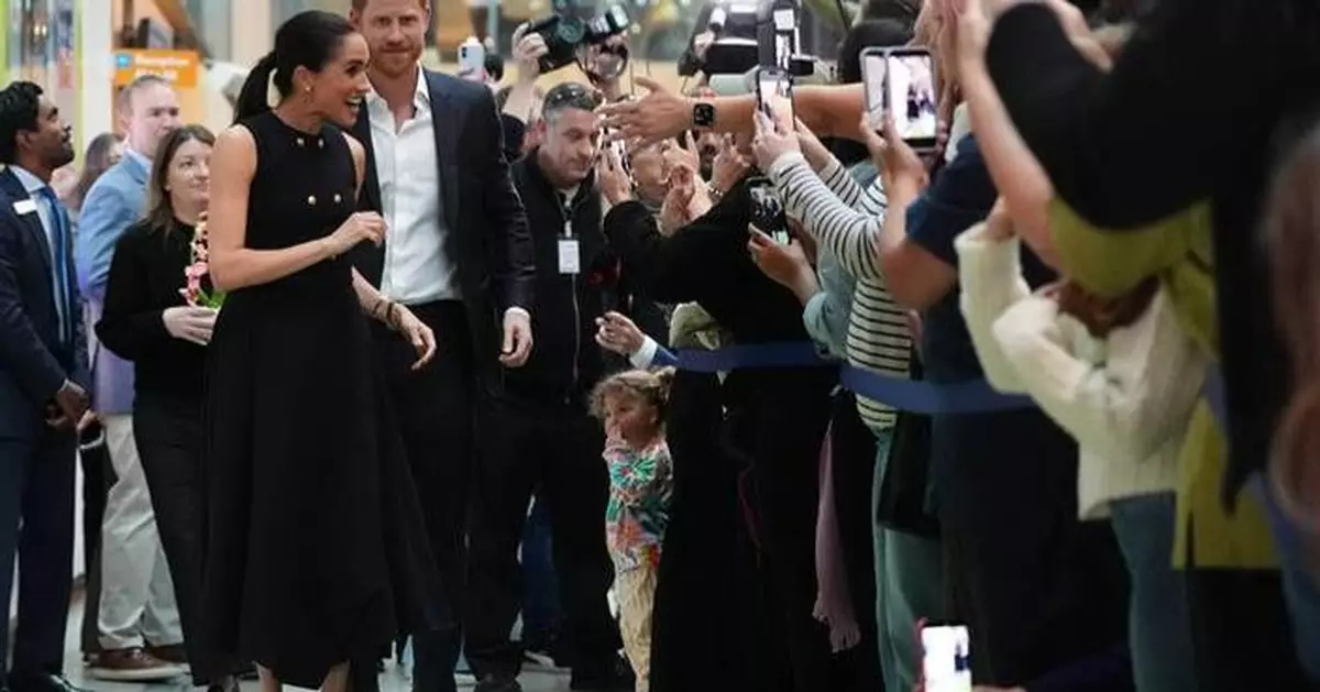 Prince Harry and Meghan arrive in Australia for a low-key, privately funded visit