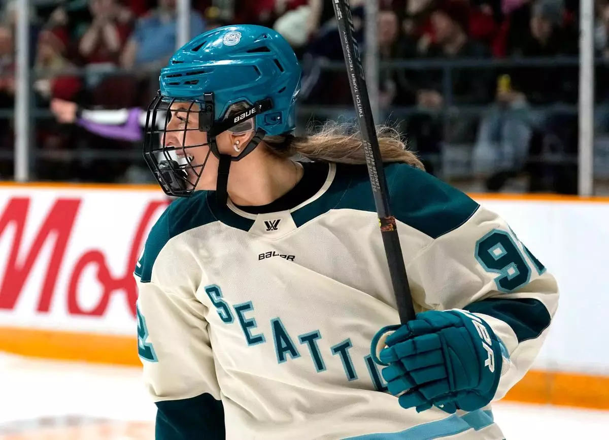 Seattle Torrent's Danielle Serdachny (92) celebrates her goal against the Ottawa Charge during second period PWHL hockey action in Ottawa, on Wednesday, April 8, 2026. (ustin Tang/The Canadian Press via AP)