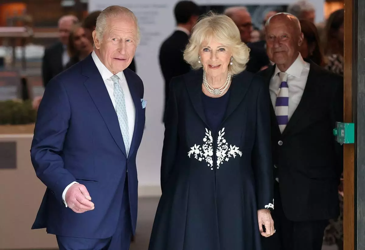 Britain's King Charles and Queen Camilla attend a presentation on the final design for the national memorial to Queen Elizabeth II at the British Museum, on the 100th anniversary of the late queen's birth, in London, Tuesday, April 21, 2026. (Toby Melville/Pool Photo via AP)