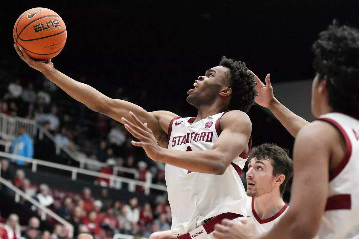 FILE - Stanford guard Ebuka Okorie (1) drives to the basket against Clemson during the first half of an NCAA college basketball game in Stanford, Calif., Feb. 4, 2026. (AP Photo/Tony Avelar, File)