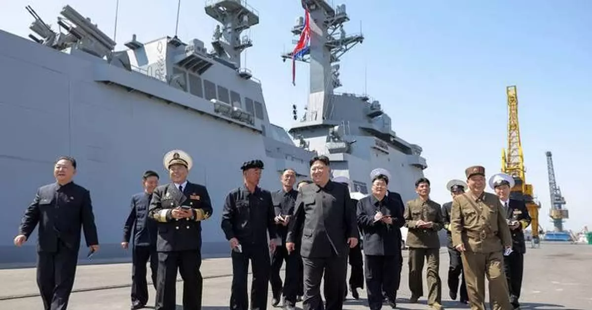 North Korean leader supervises missile tests from his naval destroyer