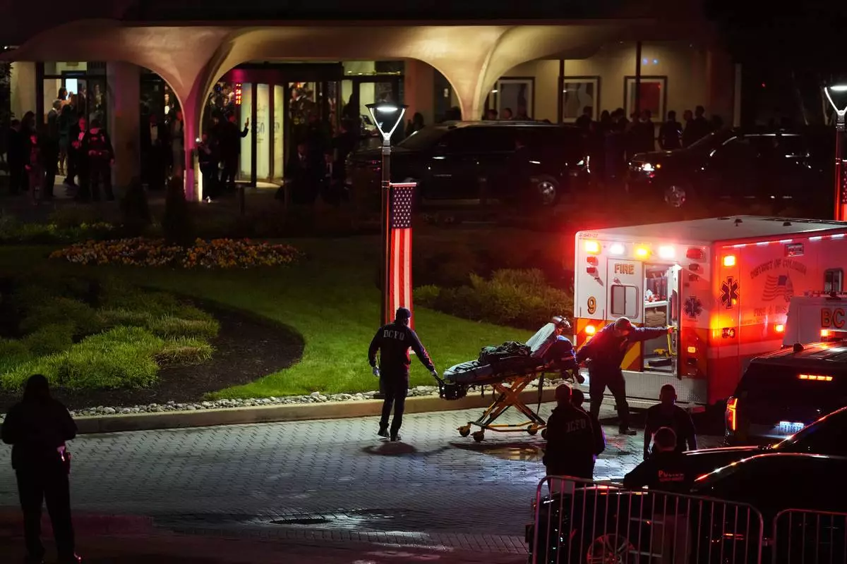 An ambulance responds to an incident at the Washington Hilton during the White House Correspondents Dinner, Saturday, April 25, 2026, in Washington. (AP Photo/Allison Robbert)