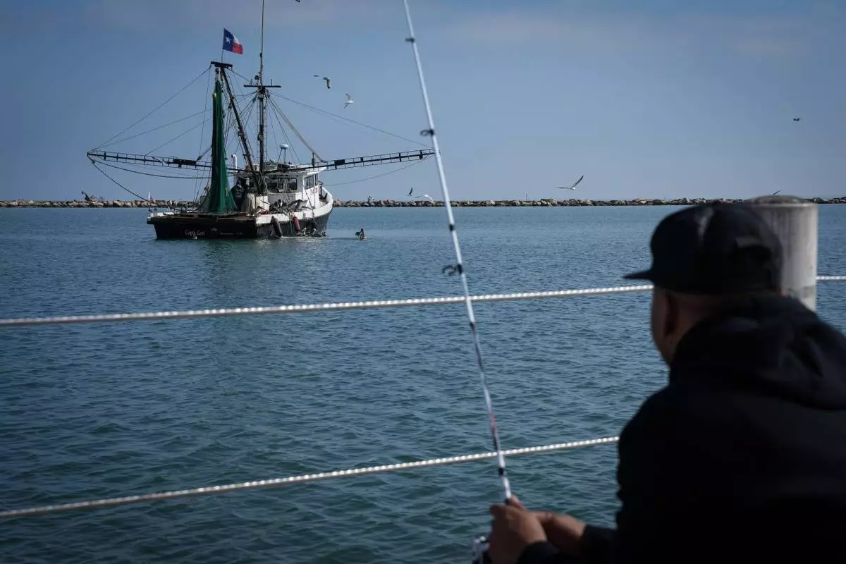 A fishing boat works just offshore in the Corpus Christi Bay on Thursday, Nov. 16, 2023, in Corpus Christi, Texas. (Jon Shapley/Houston Chronicle via AP)