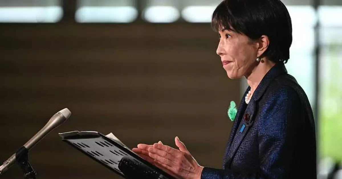 Japan's prime minister launches a panel to review her country's defense policies as threats escalate